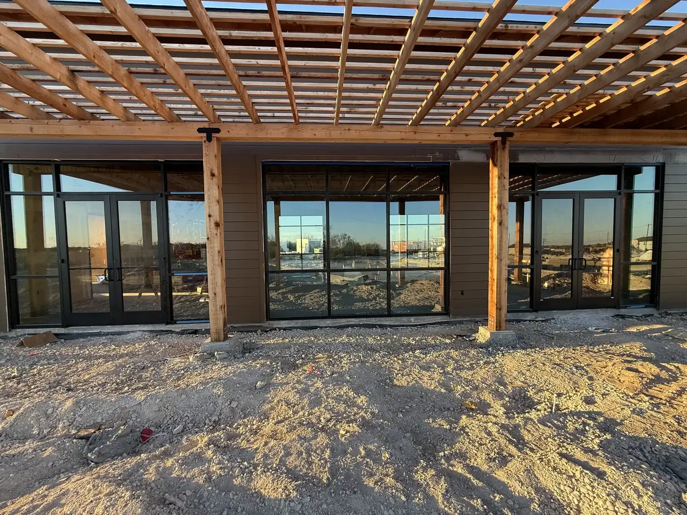 Black-frame storefront systems and entry doors, new construction