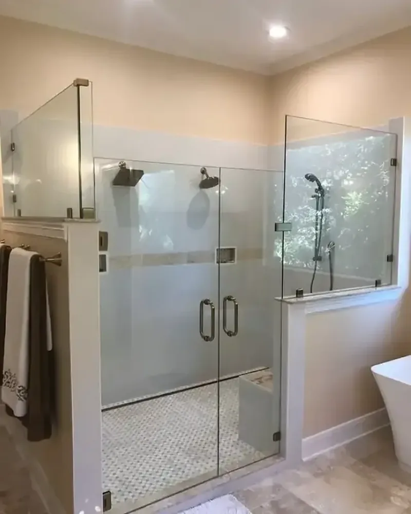 After: Master Glass Solutions custom frameless shower door with crystal-clear view, modern hinges, and open light